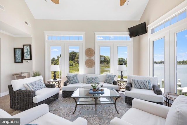 living room featuring ceiling fan, french doors, and high vaulted ceiling