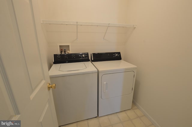 laundry room with separate washer and dryer