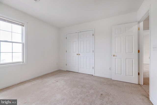 garage with gas water heater and wood walls