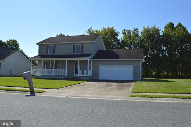 view of front of house with a garage, a front yard, and a porch