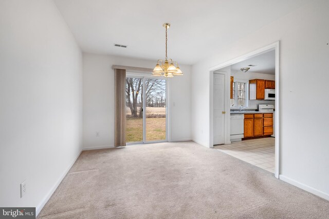 kitchen featuring sink and white appliances