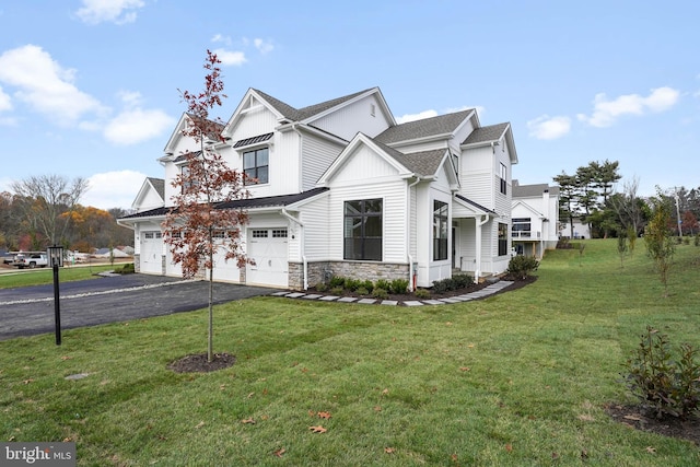 view of front facade with a garage and a front lawn