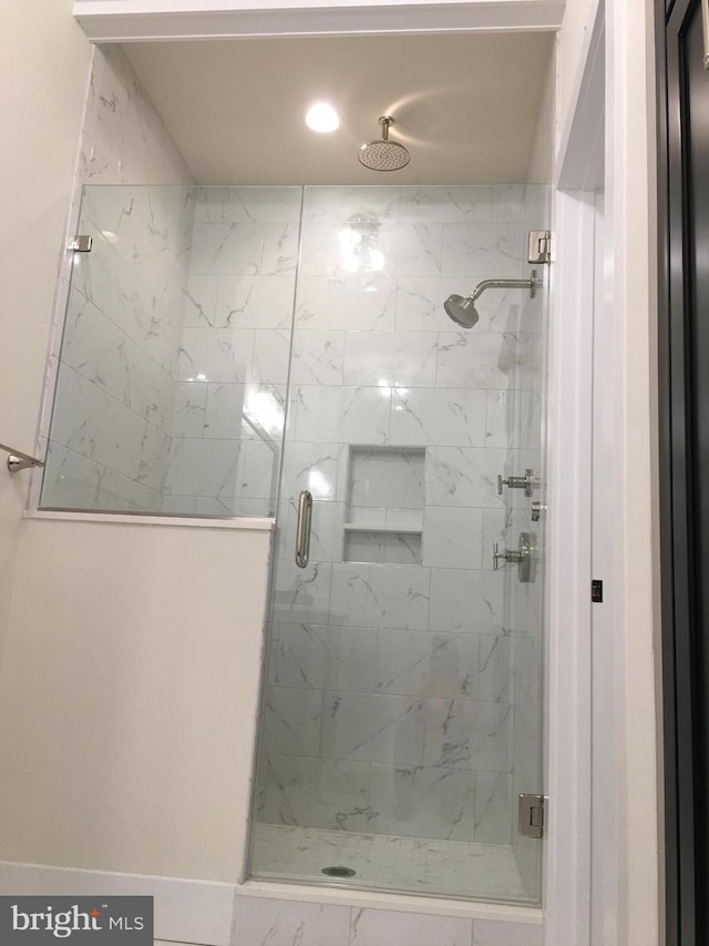 bathroom featuring an enclosed shower