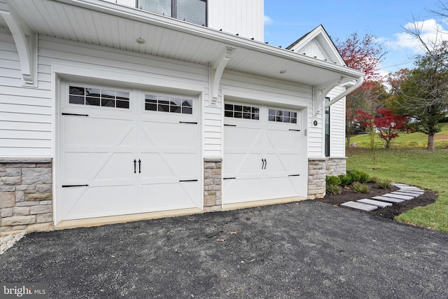 garage with a lawn