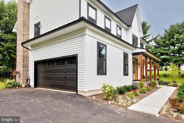 view of side of home with a garage