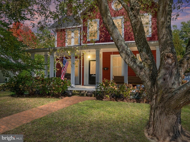 view of front of house with a lawn