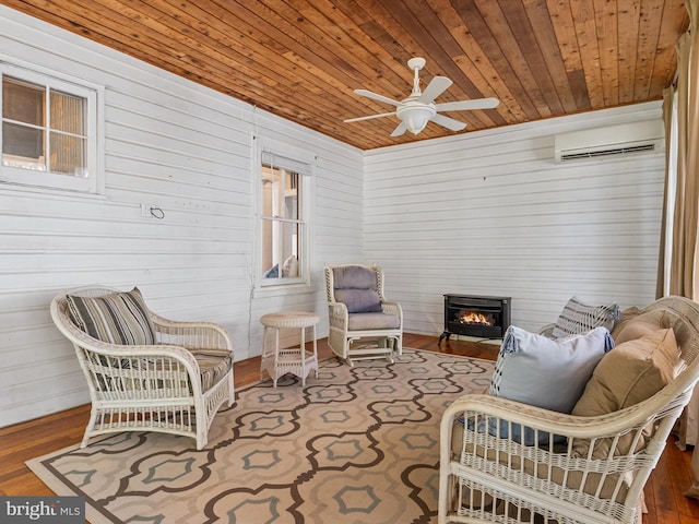 sunroom / solarium featuring an AC wall unit, ceiling fan, and wooden ceiling