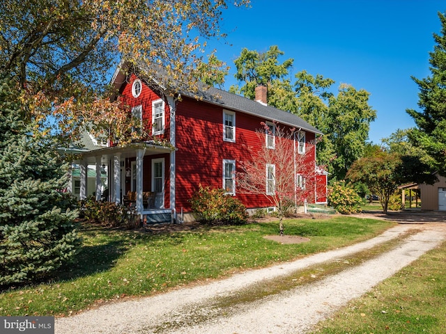 view of home's exterior with a lawn