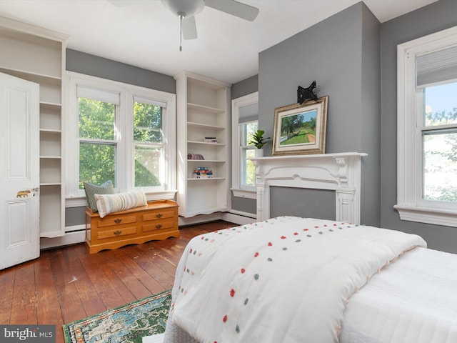 bedroom featuring ceiling fan and dark wood-type flooring