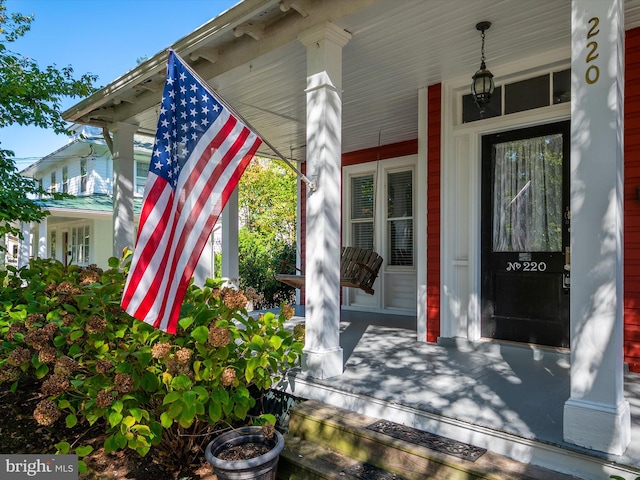 entrance to property featuring covered porch