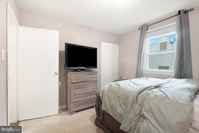 bedroom with light carpet