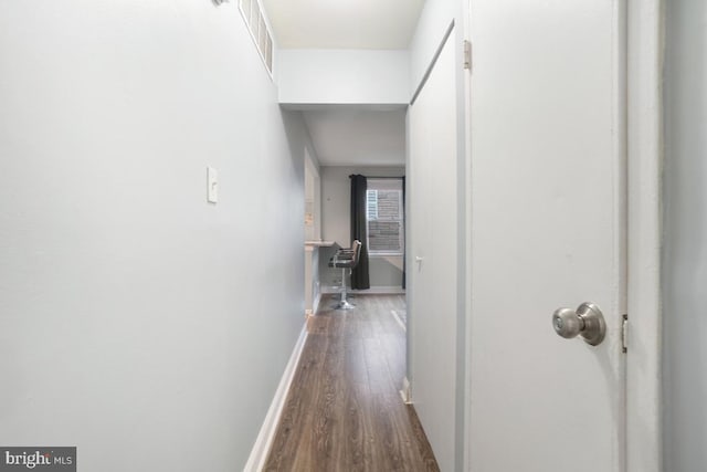 corridor featuring hardwood / wood-style floors