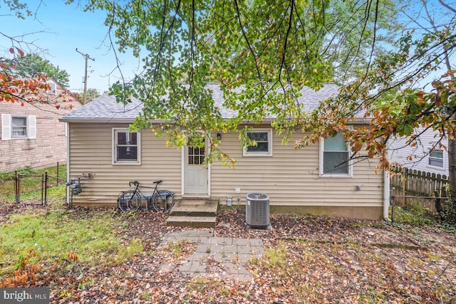 rear view of house with cooling unit