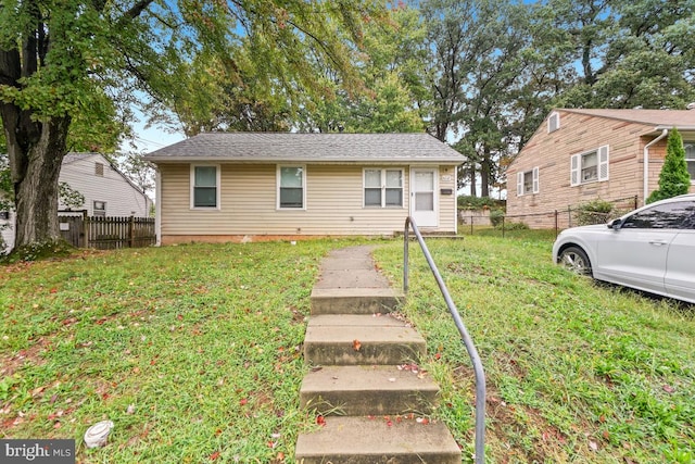 view of front of home with a front lawn