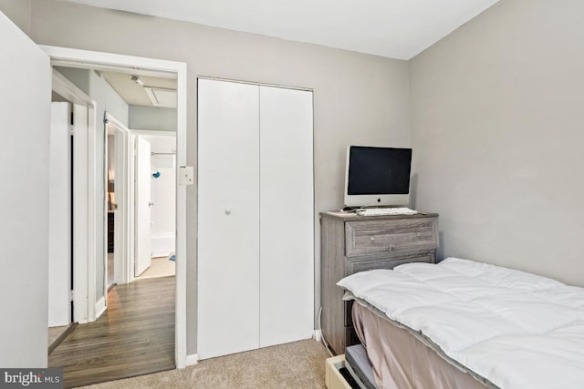 bedroom with a closet and hardwood / wood-style flooring