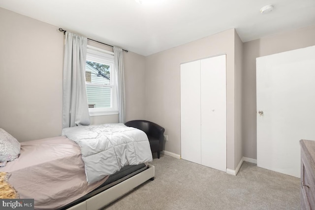 carpeted bedroom with a closet