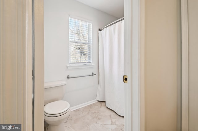 full bath with toilet, baseboards, and marble finish floor