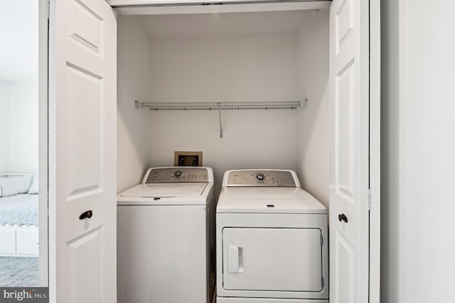 laundry room featuring washer and dryer and laundry area