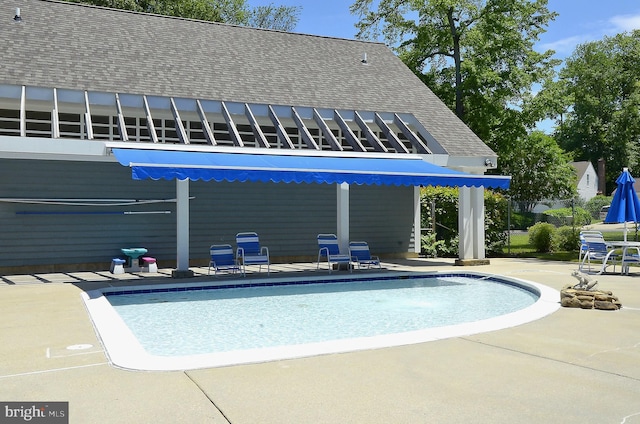 outdoor pool with a patio