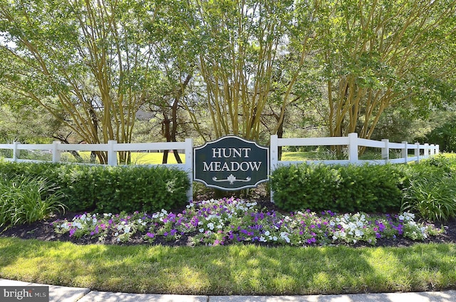 community sign with fence