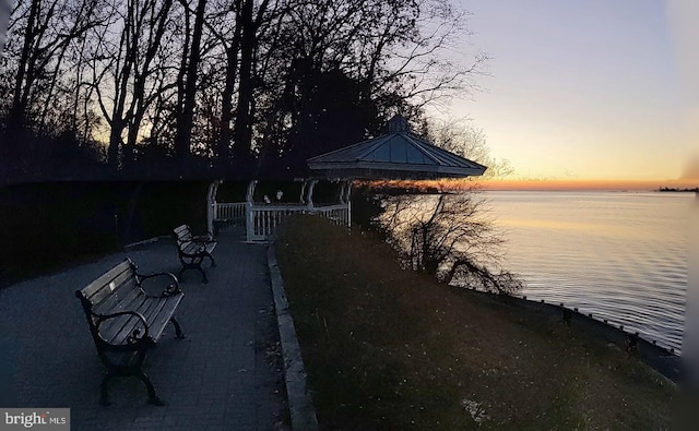 dock area featuring a gazebo and a water view