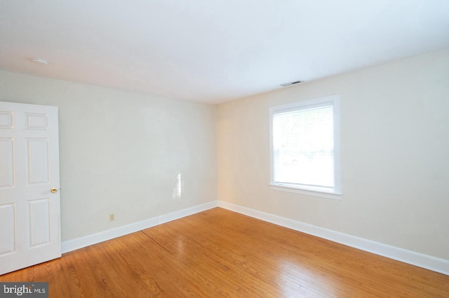 spare room featuring hardwood / wood-style flooring