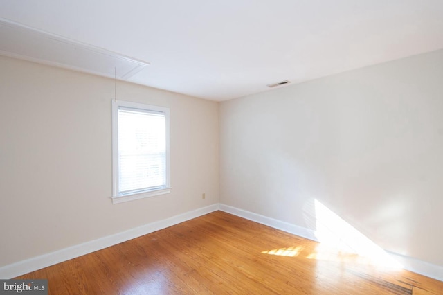 empty room with wood-type flooring