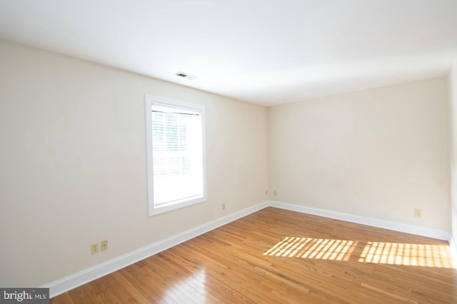 empty room featuring hardwood / wood-style flooring