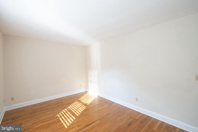 spare room with light wood-type flooring