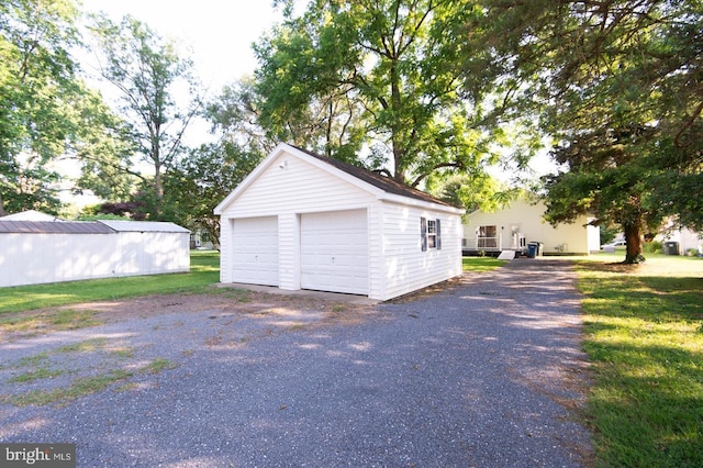 garage with a yard