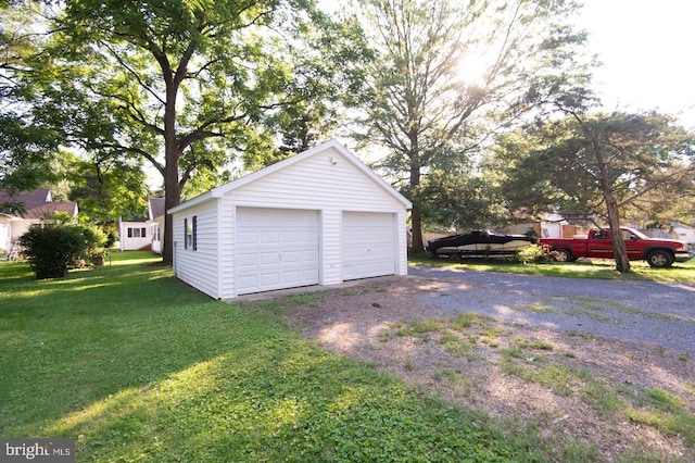 garage with a yard