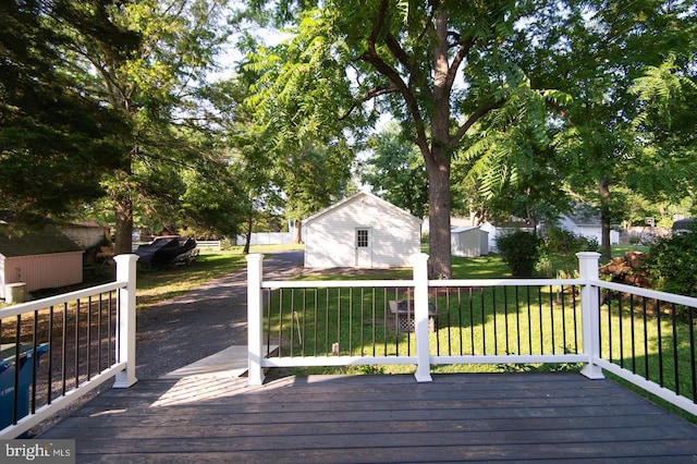 wooden terrace with a lawn