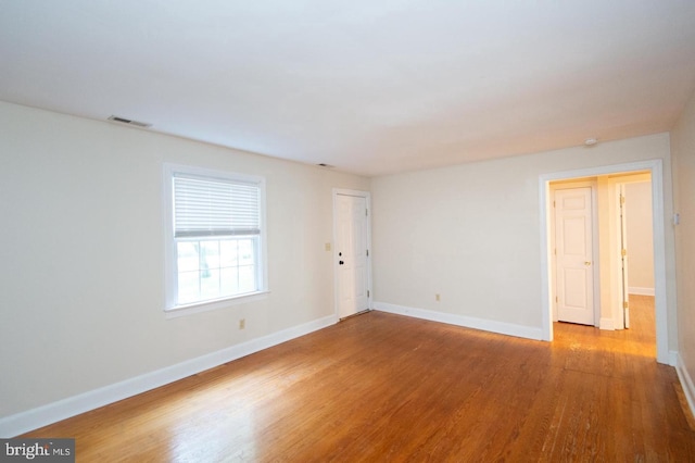 empty room with wood-type flooring