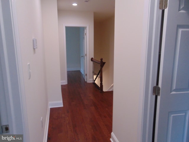 hall with dark hardwood / wood-style flooring