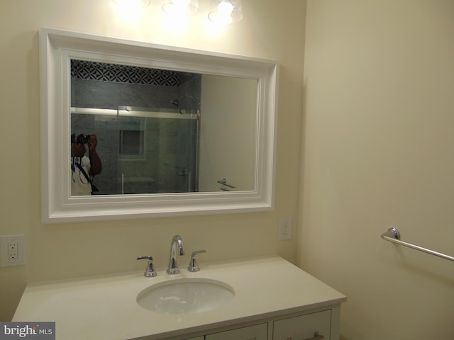 bathroom with vanity and an enclosed shower