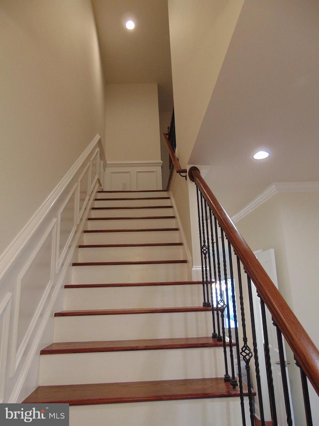 stairs featuring ornamental molding