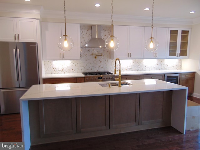 kitchen featuring white cabinets, sink, appliances with stainless steel finishes, dark hardwood / wood-style floors, and light stone countertops