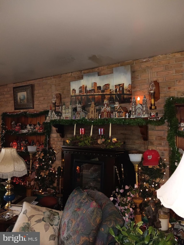 living room featuring brick wall and bar area