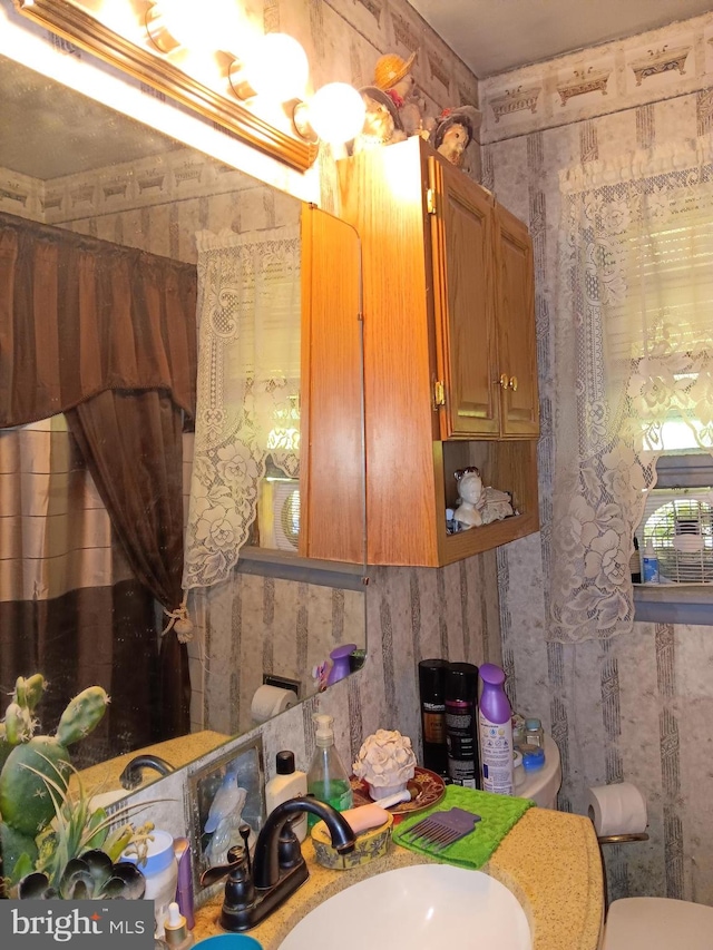 bathroom featuring sink and toilet