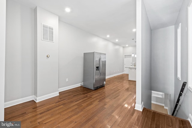 hall with wood-type flooring