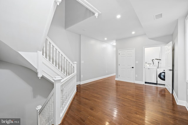 interior space with washer / clothes dryer and dark wood-type flooring