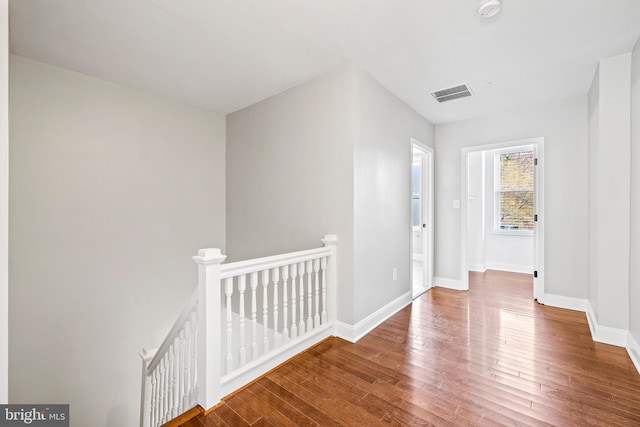 corridor featuring hardwood / wood-style floors