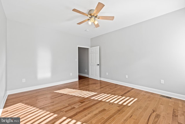 spare room with ceiling fan and hardwood / wood-style floors