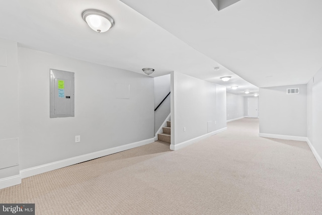 interior space featuring light carpet and electric panel