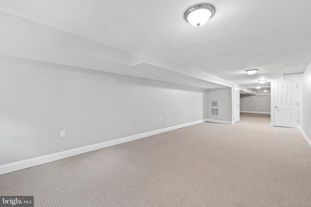 basement with light colored carpet