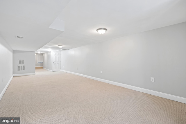 bonus room with light carpet