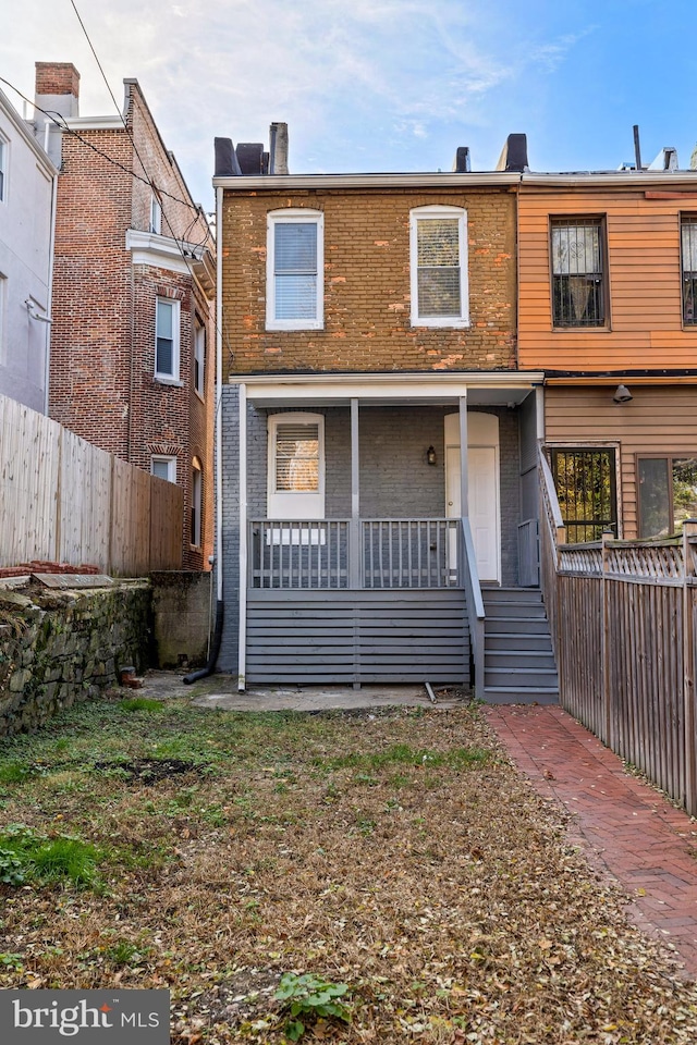 view of property featuring a porch