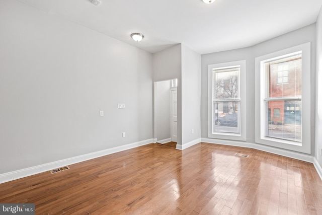 spare room featuring hardwood / wood-style flooring