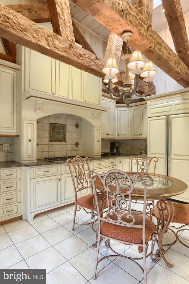 dining room featuring beamed ceiling, a chandelier, high vaulted ceiling, and light tile patterned flooring