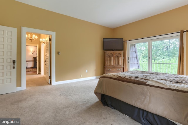 carpeted bedroom with a chandelier